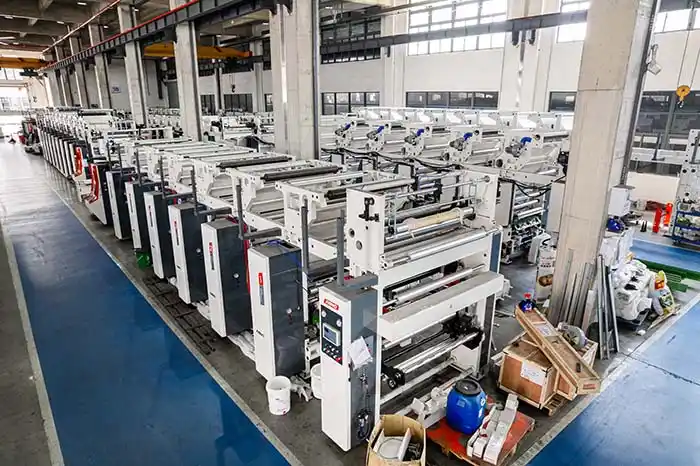 Multiple gravure printing production lines can be seen in the corridor of the industrial printing plant